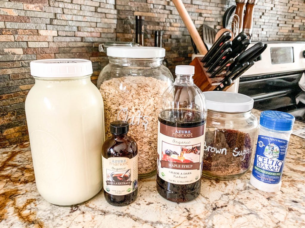 milk, brown sugar, vanilla, oats, salt, and maple syrup on granite countertop